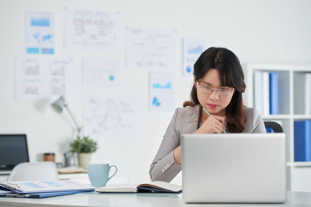 Woman looking at laptop